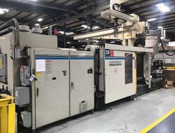 Photo of a 1000 ton Cinci Milacron plastic molder from 1996. 