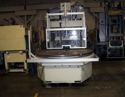 Used 130 ton Autojectors vertical molder with a large rotary table that was made in 2000