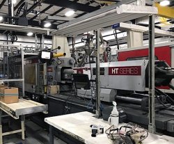 A used 230 ton Van Dorn plastic molder that was manufactured in 2000.